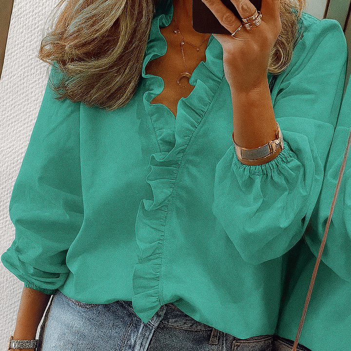 Blouse met blauwe ruches en pofmouwen