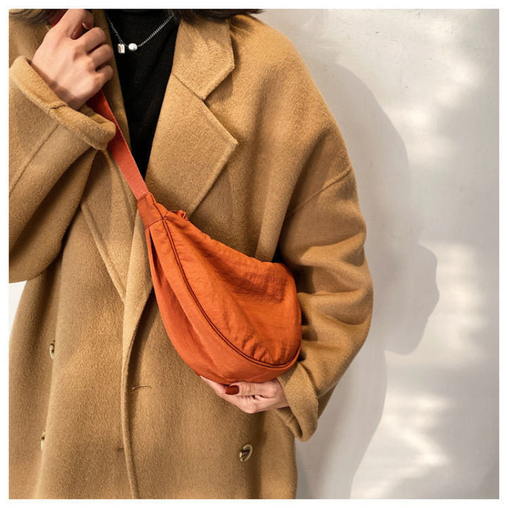 Tegan – Slanke Gebogen Schoudertas dames