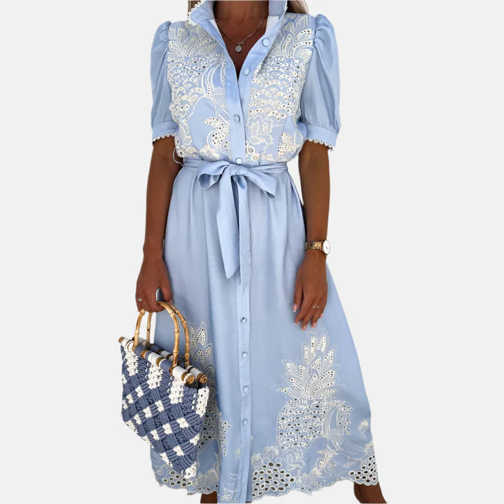 Dames geborduurde blauwe jurk